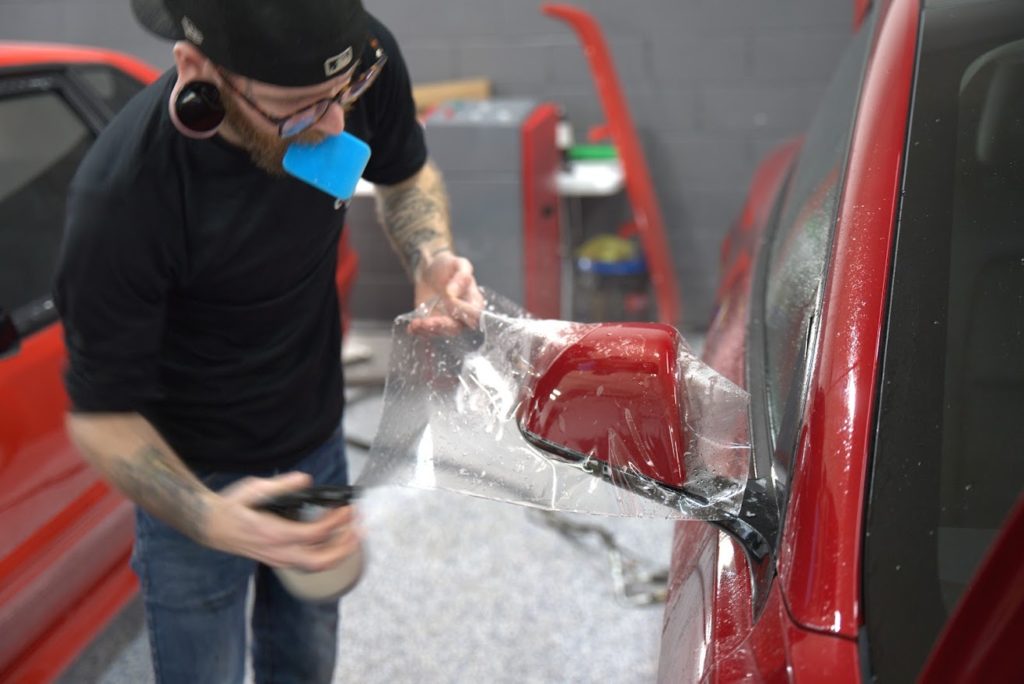 Tesla Paint Protection installed on Red Tesla Model Y at Total Detailing