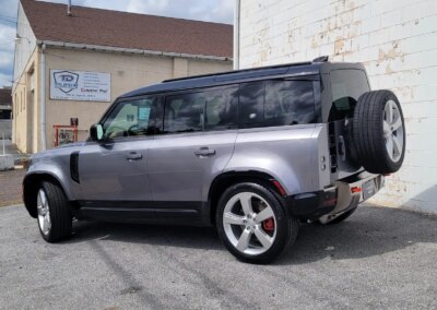A clean and shiny black car after detailing service.