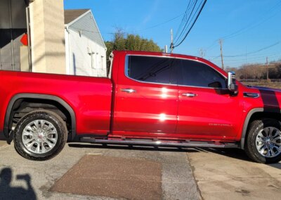 A car with foam being washed at Total Detailing Auto Spa.